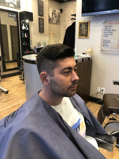 Fade haircut in progress at Deja Vu Barbershop