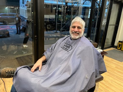 Happy client at Deja Vu Barbershop
