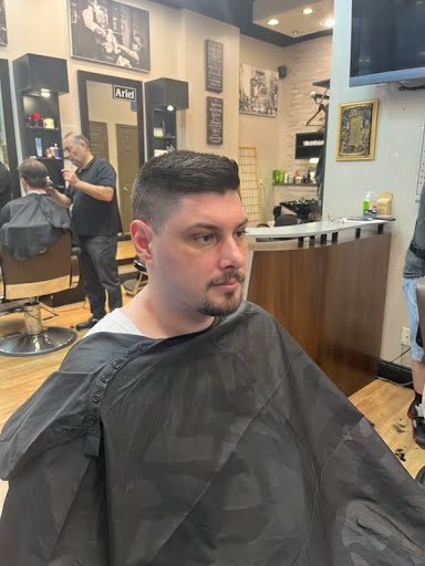 Fade haircut with barber working at Deja Vu Barbershop