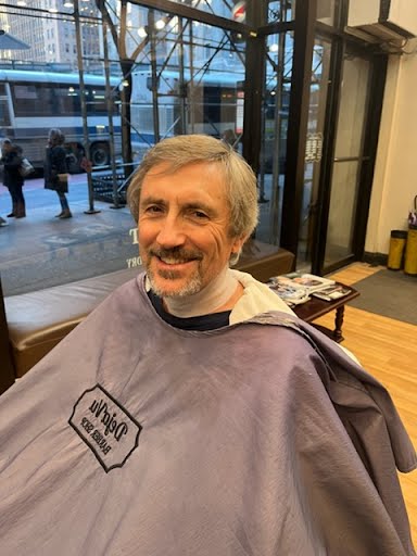 Client with fresh cut at Deja Vu Barbershop